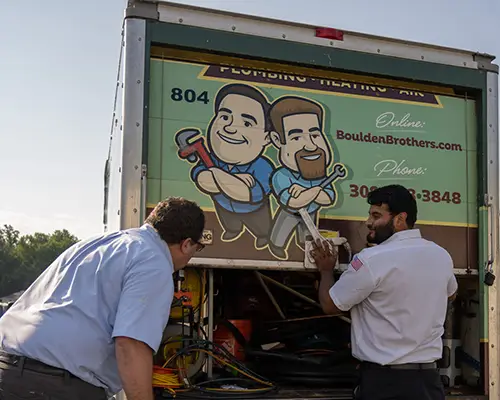 Boulden Brothers service technicians working at a company service truck